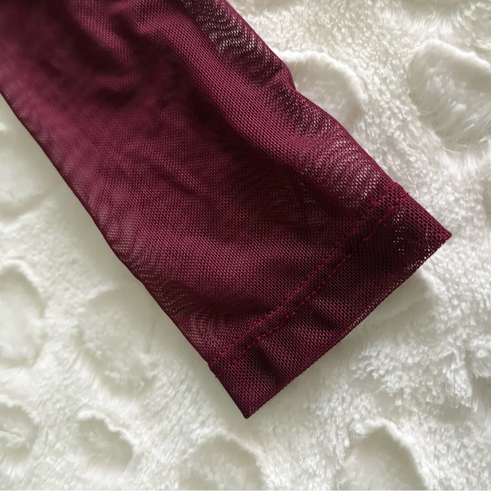 NWOT USA Vintage Burgundy Sheer Long Sleeve Bodysuit in Size Medium.